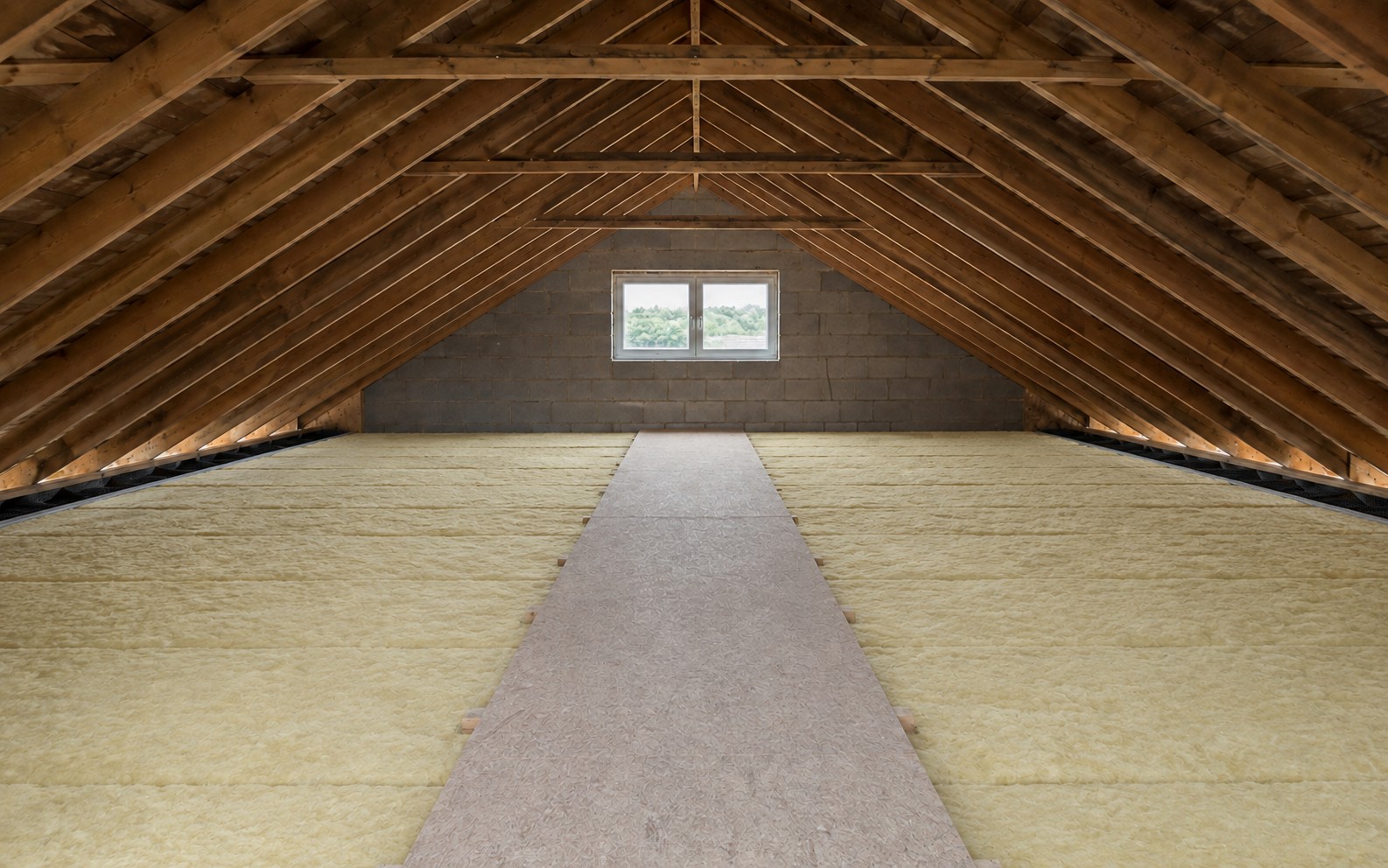 The same loft insulated between and over the joists