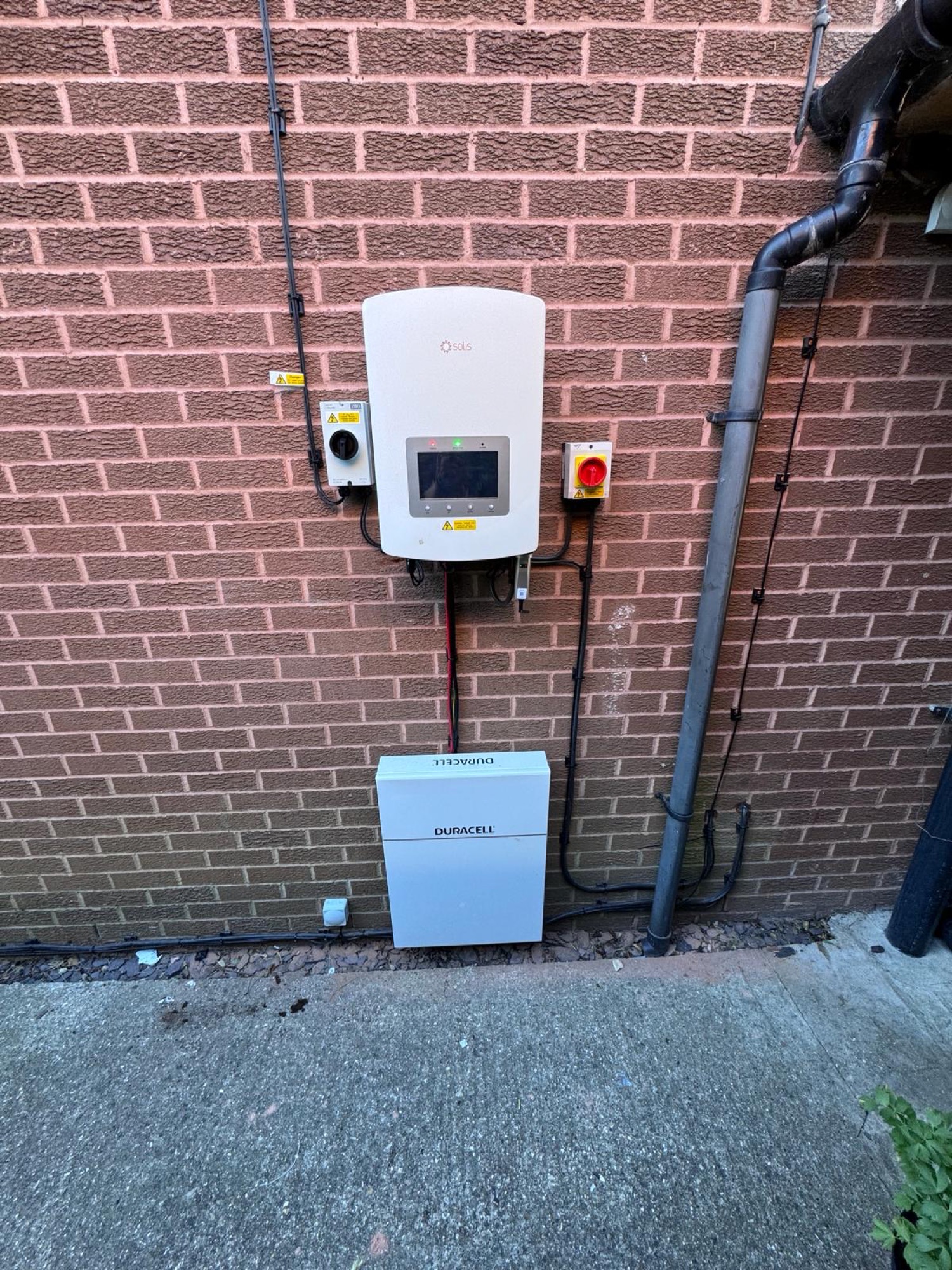 A home battery and inverter installed at a property