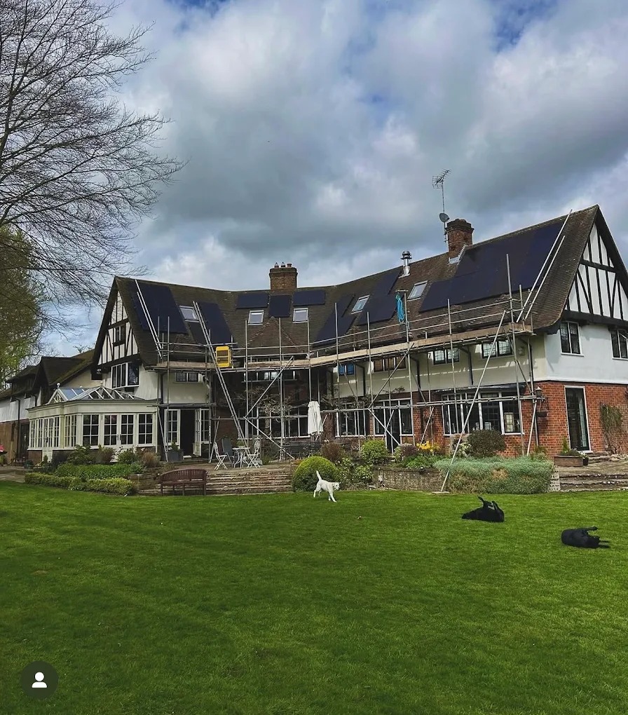 A large house, scaffolded and finished