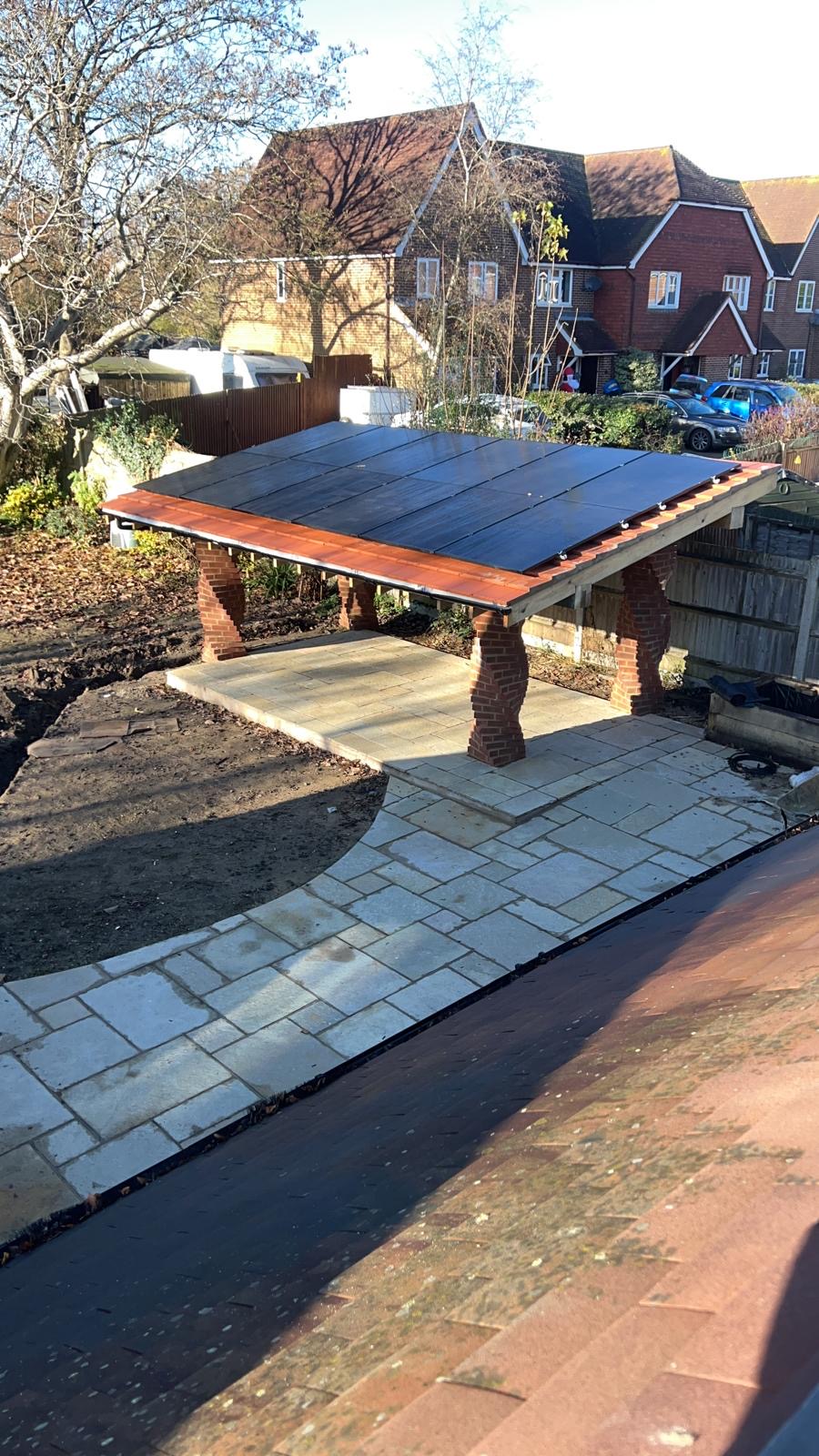 Solar panels mounted on a garden outbuilding roof