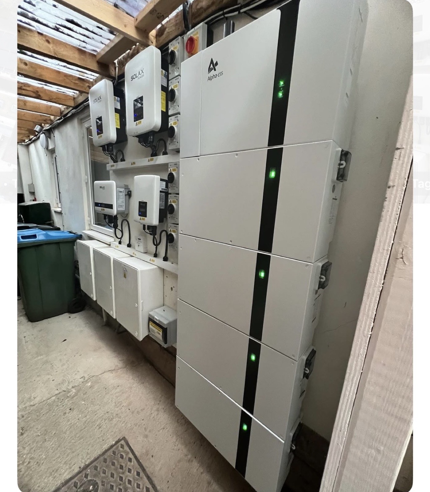 Inverters and battery modules on a utility room wall