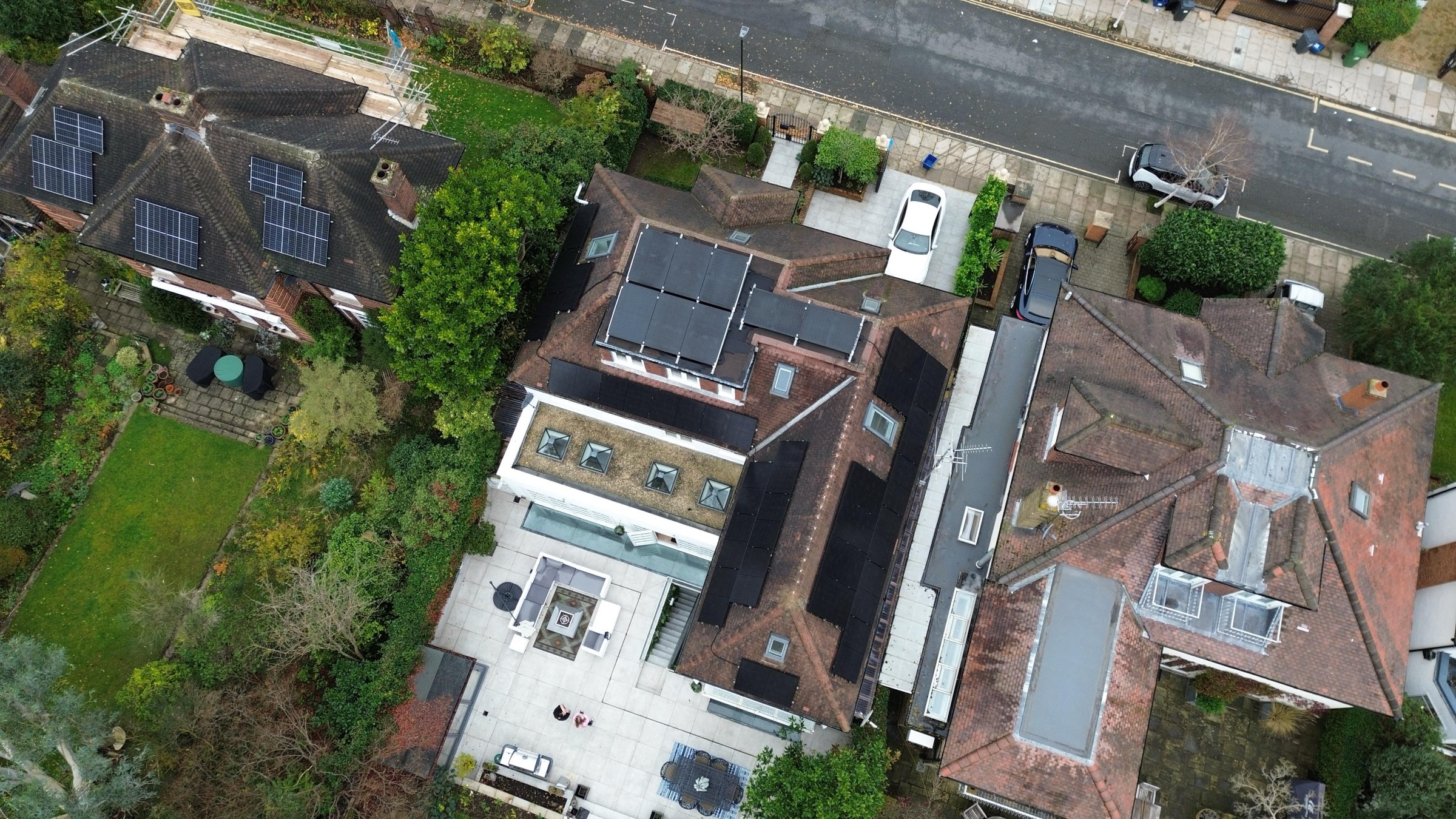 Aerial view of a property with roof-mounted solar panels